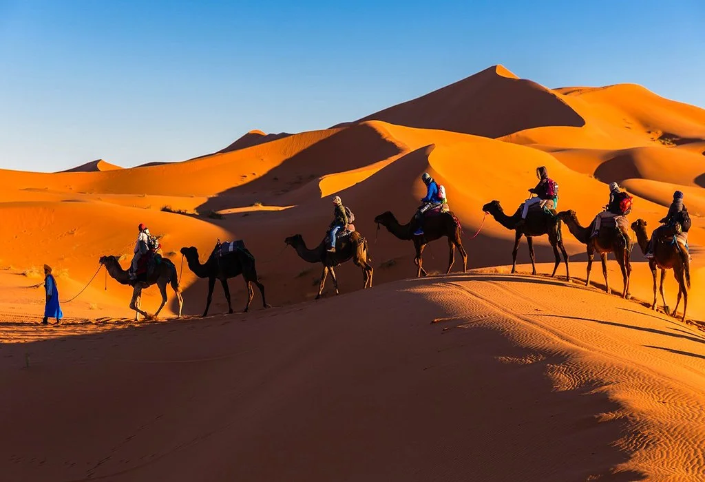 Best time to visit Sahara Desert golden hour camel trek at Erg Chebbi Merzouga