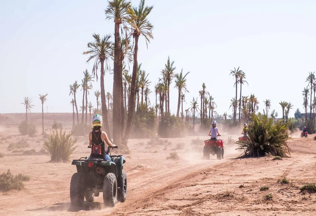 Couple enjoying quad biking tour in Marrakech Palmeraie