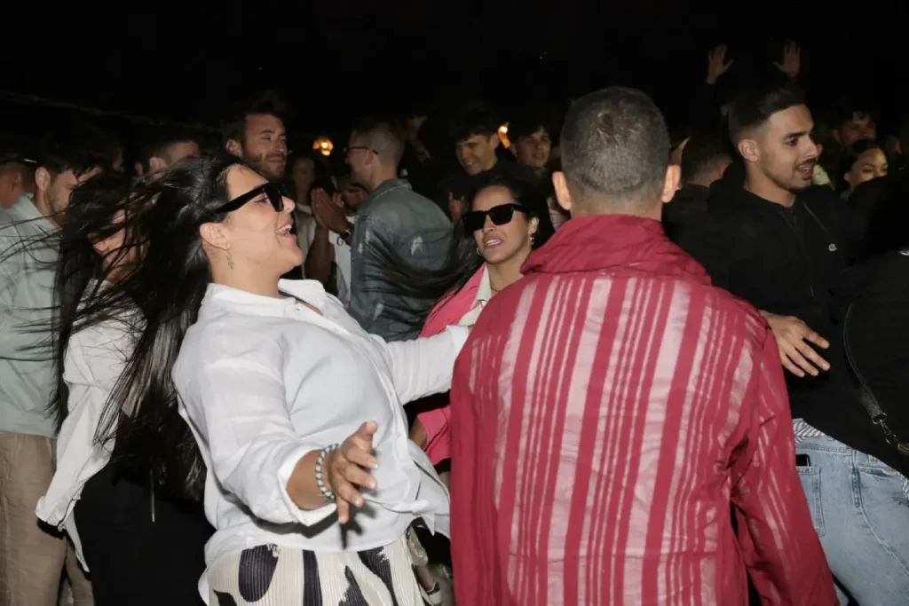 Group dancing in the show of Agafay desert camp