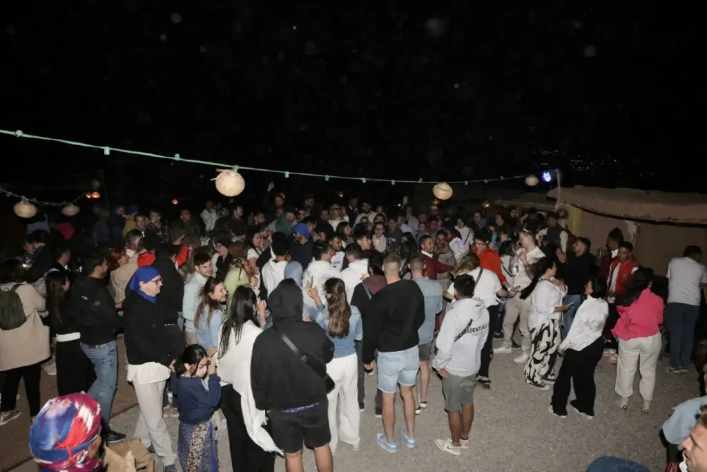 Group enjoying the show Agafay desert camp